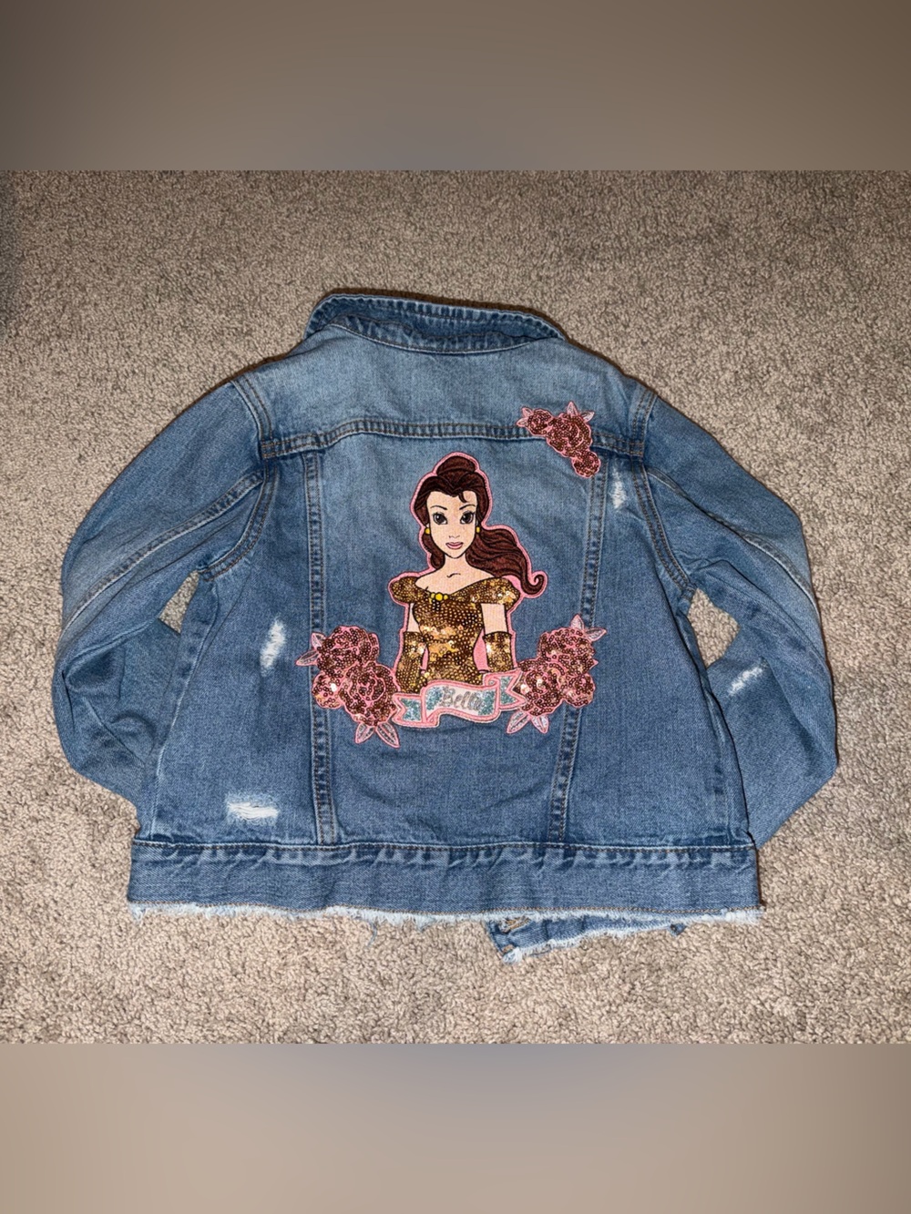 Disney denim jacket with belle sequin patch.
